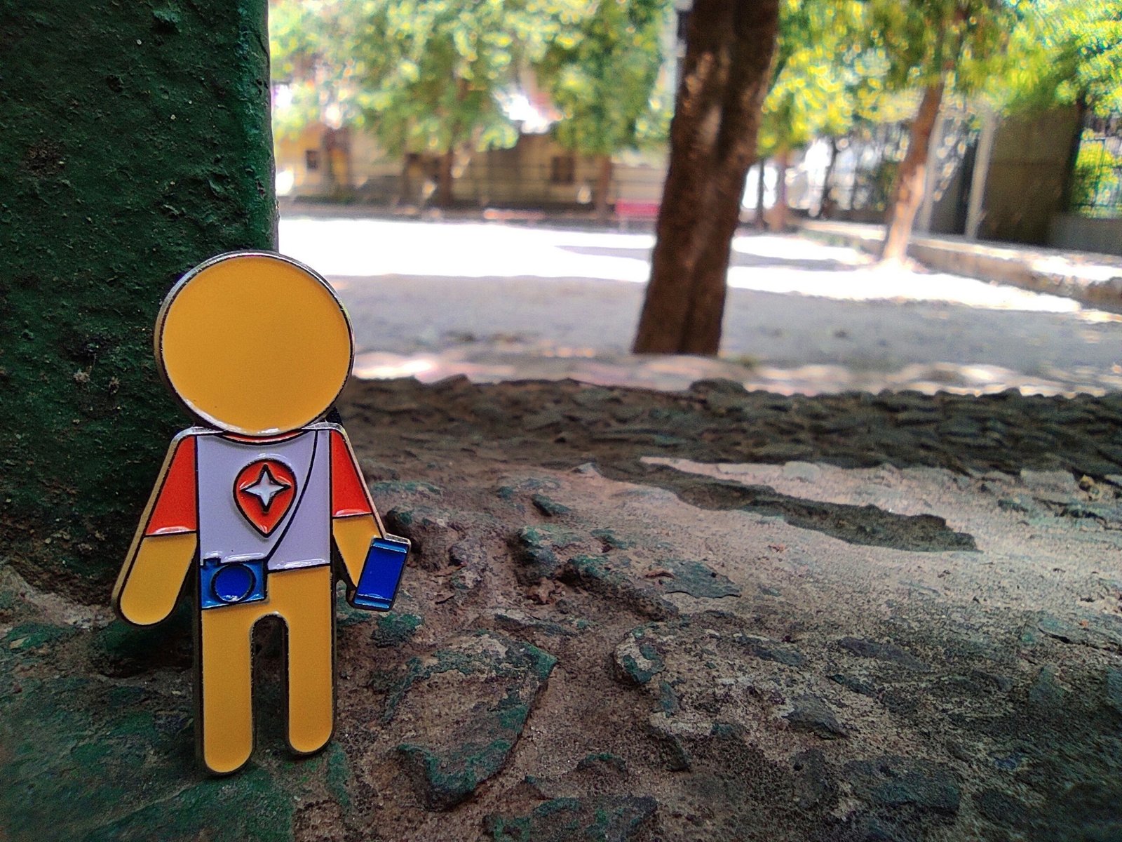 A paper cut out of a man standing next to a tree